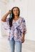 Fabled in Floral Draped Peplum Top in Blue